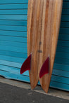 A side-view closeup of the glass-on fins shows the ahi red option.