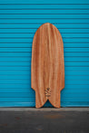 Wooden paipo surfboard with an iwa bird, the signature of shaper Chris Miyashiro, engraved at the bottom. The tail of body board looks like a fancy fish tail, called swallow sting.