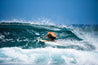 Harley Courts gets low on his Bizia wooden fish and pulls into a tight barrel.
